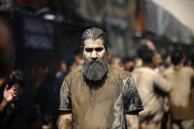 Mourners commemorate Karbala martyrs on Ashura in Iran??????? TEHRAN, IRAN - JUNE 25: Members of the Lur ethnic community take part in the traditional Gil-mali (mud-smearing) ritual during Ashura commemorations at Osshaghol Abbas Hosseiniyeh in Tehran, Iran, on June 25, 2026. Marking the anniversary of the martyrdom of Imam Hussein, the grandson of Prophet Muhammad, and his 72 companions in Karbala, participants covered themselves in mud as a sign of mourning and remembrance. Fatemeh Bahrami Anadolu Tehran Iran. Editorial use only. Please get in touch for any other usage.  Copyright: x2026xAnadoluxFatemehxBahramix
