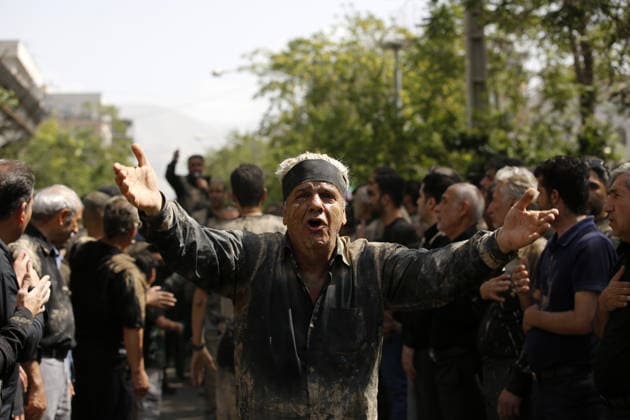 Mourners commemorate Karbala martyrs on Ashura in Iran??????? TEHRAN, IRAN - JUNE 25: Members of the Lur ethnic community take part in the traditional Gil-mali (mud-smearing) ritual during Ashura commemorations at Osshaghol Abbas Hosseiniyeh in Tehran, Iran, on June 25, 2026. Marking the anniversary of the martyrdom of Imam Hussein, the grandson of Prophet Muhammad, and his 72 companions in Karbala, participants covered themselves in mud as a sign of mourning and remembrance. Fatemeh Bahrami Anadolu Tehran Iran. Editorial use only. Please get in touch for any other usage.  Copyright: x2026xAnadoluxFatemehxBahramix