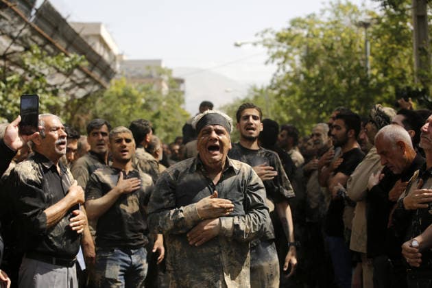 Mourners commemorate Karbala martyrs on Ashura in Iran??????? TEHRAN, IRAN - JUNE 25: Members of the Lur ethnic community take part in the traditional Gil-mali (mud-smearing) ritual during Ashura commemorations at Osshaghol Abbas Hosseiniyeh in Tehran, Iran, on June 25, 2026. Marking the anniversary of the martyrdom of Imam Hussein, the grandson of Prophet Muhammad, and his 72 companions in Karbala, participants covered themselves in mud as a sign of mourning and remembrance. Fatemeh Bahrami Anadolu Tehran Iran. Editorial use only. Please get in touch for any other usage.  Copyright: x2026xAnadoluxFatemehxBahramix