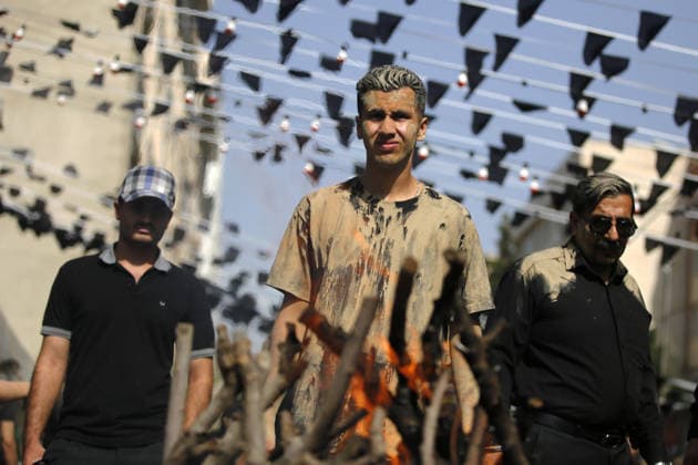 Mourners commemorate Karbala martyrs on Ashura in Iran??????? TEHRAN, IRAN - JUNE 25: Members of the Lur ethnic community take part in the traditional Gil-mali (mud-smearing) ritual during Ashura commemorations at Osshaghol Abbas Hosseiniyeh in Tehran, Iran, on June 25, 2026. Marking the anniversary of the martyrdom of Imam Hussein, the grandson of Prophet Muhammad, and his 72 companions in Karbala, participants covered themselves in mud as a sign of mourning and remembrance. Fatemeh Bahrami Anadolu Tehran Iran. Editorial use only. Please get in touch for any other usage.  Copyright: x2026xAnadoluxFatemehxBahramix