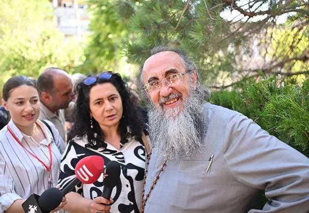 Armenia Archbishop Coup Plot Trial 9195164 25.06.2026 Archbishop Mikael Ajapahyan, head of the Shirak Diocese of the Armenian Apostolic Church, reacts after a hearing at the Court of Appeal in Yerevan, Armenia. The court released Ajapakhyan from house arrest and overturned the verdict of the Criminal Court of General Jurisdiction of Yerevan. On October 3, 2025 a Criminal Court of General Jurisdiction sentenced Ajapahyan to two years in prison for calling for the seizure of power and the violent overthrow of the constitutional order. Aram Nersesyan Sputnik Yerevan Armenia  Copyright: xAramxNersesyanx