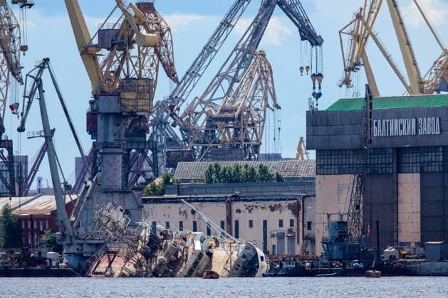 RUSSIA, ST PETERSBURG - JUNE 25, 2026: Salvage operations are underway for the Kapitan Ushakov tugboat at the Baltic Shipyard. The vessel partially sank on 8 August 2025, after listing to its starboard during construction work; no injuries reported. The damage was estimated by specialists from the North-Western Interregional Directorate of the Federal Service for Supervision of Natural Resources (Rosprirodnadzor) at 651 million rubles. Peter Kovalev TASS  94260492