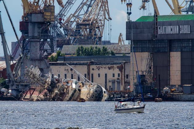 RUSSIA, ST PETERSBURG - JUNE 25, 2026: Salvage operations are underway for the Kapitan Ushakov tugboat at the Baltic Shipyard. The vessel partially sank on 8 August 2025, after listing to its starboard during construction work; no injuries reported. The damage was estimated by specialists from the North-Western Interregional Directorate of the Federal Service for Supervision of Natural Resources (Rosprirodnadzor) at 651 million rubles. Peter Kovalev TASS  94260502