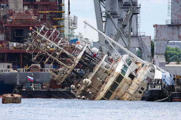 RUSSIA, ST PETERSBURG - JUNE 25, 2026: Salvage operations are underway for the Kapitan Ushakov tugboat at the Baltic Shipyard. The vessel partially sank on 8 August 2025, after listing to its starboard during construction work; no injuries reported. The damage was estimated by specialists from the North-Western Interregional Directorate of the Federal Service for Supervision of Natural Resources (Rosprirodnadzor) at 651 million rubles. Peter Kovalev TASS  94260516