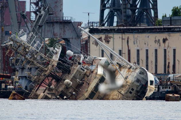 RUSSIA, ST PETERSBURG - JUNE 25, 2026: Salvage operations are underway for the Kapitan Ushakov tugboat at the Baltic Shipyard. The vessel partially sank on 8 August 2025, after listing to its starboard during construction work; no injuries reported. The damage was estimated by specialists from the North-Western Interregional Directorate of the Federal Service for Supervision of Natural Resources (Rosprirodnadzor) at 651 million rubles. Peter Kovalev TASS  94260510