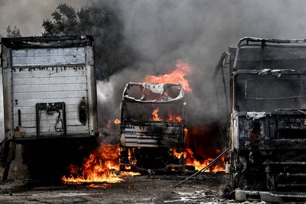 Trucks are engulfed by smoke from a fire at a parking lot, caused by Russian drone strikes, Zaporizhzhia, Ukraine, June 25, 2026. The Russian army attacked the city with strike drones, targeting a petrol station, Ukrzaliznytsia (Ukrainian Railways) locomotives and a parking lot. Fires broke out, and one person was killed as a result of the attack. (Photo by Dmytro Smolienko Ukrinform) Russia attacks parking lot in Zaporizhzhia with drones  Copyright: xDmytroxSmolienkox