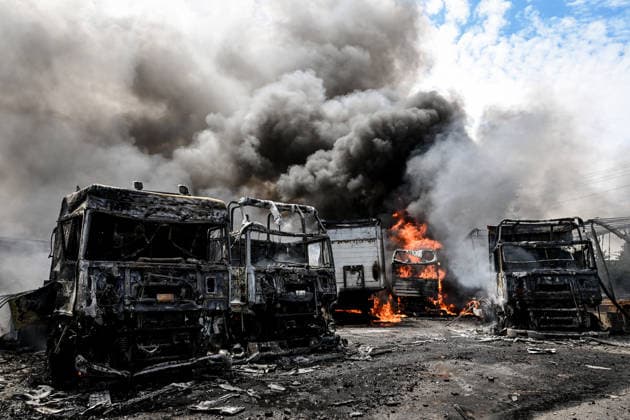 Trucks are engulfed by smoke from a fire at a parking lot, caused by Russian drone strikes, Zaporizhzhia, Ukraine, June 25, 2026. The Russian army attacked the city with strike drones, targeting a petrol station, Ukrzaliznytsia (Ukrainian Railways) locomotives and a parking lot. Fires broke out, and one person was killed as a result of the attack. (Photo by Dmytro Smolienko Ukrinform) Russia attacks parking lot in Zaporizhzhia with drones  Copyright: xDmytroxSmolienkox