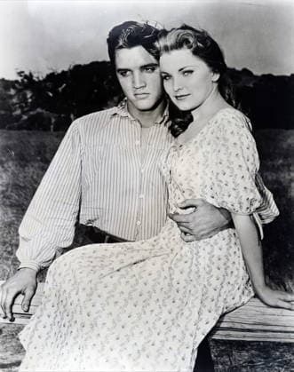 RECORD DATE NOT STATED Photograph of Elvis and Priscilla Presley while on the set of Love me Tender Photograph of Elvis and Priscilla Presley while on the set of Love me Tender . Elvis Presley (1935-1977) an American singer, musician, and actor. Priscilla Presley (1945-) an American actress and business magnate. Dated 20th century Editorial use only. All other uses to be cleared with the copyright owner (World History Archive), in advance., WHA_102_0390.jpg, Elvis Presley; Priscilla Presley; Love me Tender; American singer; American actress; musician; actor; business magnate; 20th century; celebrity couple; vintage; Hollywood; on set; black and white; iconic; famous; rock and roll; music legend; film; romance; husband and wife; Elvis and Copyright: xx
