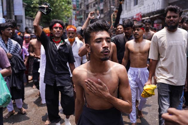 June 26, 2026, Dhaka, Dhaka, Bangladesh: Dhaka, June 26, 2026: Marking the 10th day of Muharram, the holy day of Ashura, members of the Shia Muslim community observed the occasion with Tazia processions, matam (ritual mourning), and other religious ceremonies in remembrance of the martyrdom of Imam Hussain, the grandson of Prophet Muhammad, at the Battle of Karbala. The mourning procession began at the historic Hussaini Dalan in Old Dhaka and concluded at Zigatola. As part of the observance, some devotees donated chickens and pigeons as acts of charity and devotion. People from different communities gathered along both sides of the roads to watch the Ashura procession, reflecting the day s profound religious and cultural significance. Dhak - ZUMAk185 20260626_zip_k185_014 Copyright: xRubelxKarmakerx