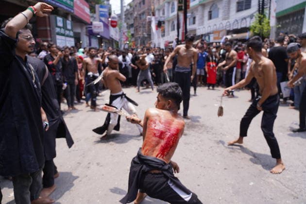 June 26, 2026, Dhaka, Dhaka, Bangladesh: Dhaka, June 26, 2026: Marking the 10th day of Muharram, the holy day of Ashura, members of the Shia Muslim community observed the occasion with Tazia processions, matam (ritual mourning), and other religious ceremonies in remembrance of the martyrdom of Imam Hussain, the grandson of Prophet Muhammad, at the Battle of Karbala. The mourning procession began at the historic Hussaini Dalan in Old Dhaka and concluded at Zigatola. As part of the observance, some devotees donated chickens and pigeons as acts of charity and devotion. People from different communities gathered along both sides of the roads to watch the Ashura procession, reflecting the day s profound religious and cultural significance. Dhak - ZUMAk185 20260626_zip_k185_016 Copyright: xRubelxKarmakerx