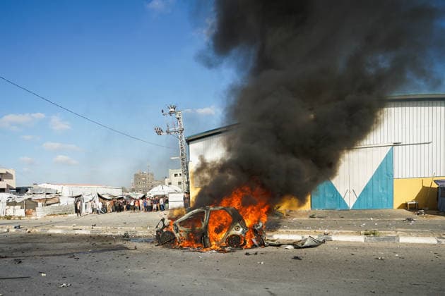 Israeli attacks continue on Gaza despite ceasefire GAZA CITY, GAZA, PALESTINE - JUNE 26: A view of a burned-out vehicle on Salah al-Din Street in central Gaza, Palestine following an Israeli strike on June 26, 2026. Three Palestinians were killed after Israeli forces targeted a civilian vehicle in an attack described as a violation of the ceasefire. The vehicle caught fire as a result of the strike, while medical, civil defense and firefighting teams were dispatched to the area. Adam Bilal Anadolu Gaza City Gaza. Editorial use only. Please get in touch for any other usage.  Copyright: x2026xAnadoluxAdamxBilalx