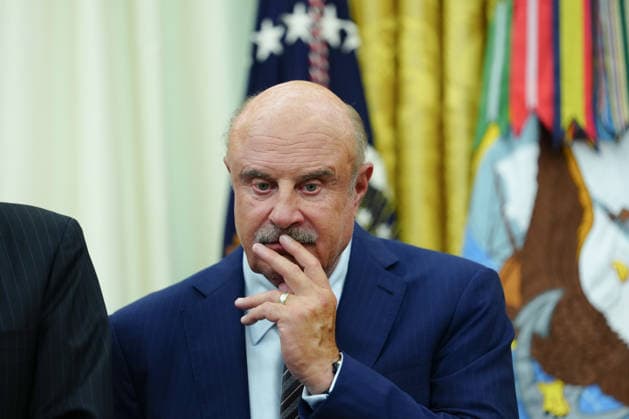 Dr. Phil McGraw looks on as President Donald Trump speaks in the Oval Office of the White House in Washington, DC on Friday, June 26, 2026. Trump is speaking on the report released by the White House Religious Liberty Commission, which was established by executive order last year.  WASP20260626612 AaronxSchwartz
