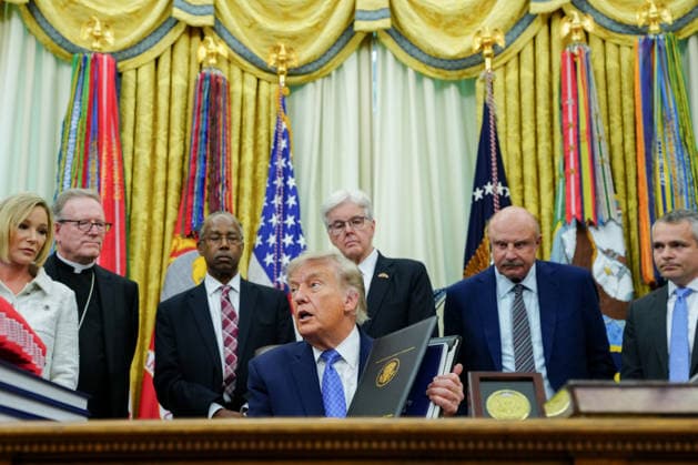 President Donald Trump speaks in the Oval Office of the White House in Washington, DC on Friday, June 26, 2026. Trump is speaking on the report released by the White House Religious Liberty Commission, which was established by executive order last year.  WASP20260626622 AaronxSchwartz