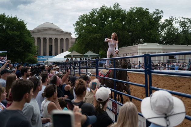 June 26, 2026, Washington, District Of Columbia, USA: A woman rides atop two horses at a rodeo during the Great American State Fair on the National Mall in Washington, D.C. on June 26, 2026. Rodeo 250, produced by Cervi Rodeo Company, is one of numerous events during the 16-day fair, celebrating the 250th anniversary of the United States of America. Washington USA - ZUMAd227 20260626_znp_d227_021 Copyright: xBryanxDozierx