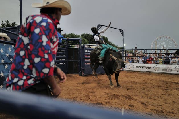 June 26, 2026, Washington, District Of Columbia, USA: Crowds watch a bull rider ride a bucking bull at a rodeo during the Great American State Fair on the National Mall in Washington, D.C. on June 26, 2026. Rodeo 250, produced by Cervi Rodeo Company, is one of numerous events during the 16-day fair, celebrating the 250th anniversary of the United States of America. Washington USA - ZUMAd227 20260626_znp_d227_049 Copyright: xBryanxDozierx
