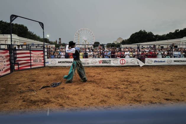 June 26, 2026, Washington, District Of Columbia, USA: A bull rider igathers his belongings after being thrown from a bucking bull at a rodeo during the Great American State Fair on the National Mall in Washington, D.C. on June 26, 2026. Rodeo 250, produced by Cervi Rodeo Company, is one of numerous events during the 16-day fair, celebrating the 250th anniversary of the United States of America. Washington USA - ZUMAd227 20260626_znp_d227_054 Copyright: xBryanxDozierx