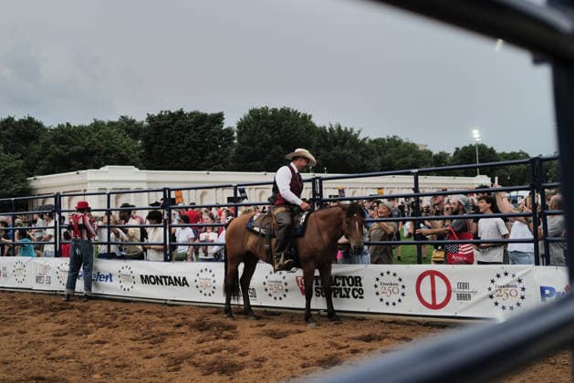 June 26, 2026, Washington, District Of Columbia, USA: A cowboy atop a horse greets people at a rodeo during the Great American State Fair on the National Mall in Washington, D.C. on June 26, 2026. Rodeo 250, produced by Cervi Rodeo Company, is one of numerous events during the 16-day fair, celebrating the 250th anniversary of the United States of America. Washington USA - ZUMAd227 20260626_znp_d227_057 Copyright: xBryanxDozierx
