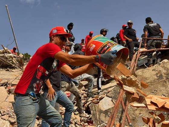 Search for people trapped under rubble continues in Venezuela s La Guaira LA GUAIRA, VENEZUELA - JUNE 26: Search and rescue operations continue at the sites of collapsed buildings in Macuto, La Guaira, Venezuela, following the earthquakes on June 26, 2026. Emergency crews continued efforts to locate and rescue people trapped beneath the rubble. Venezuela was hit with a 4.7 magnitude earthquake Friday as the nation recovers from devastating earthquakes earlier this week. The US Geological Survey (USGS) reported that an aftershock was felt 54 kilometers (34 miles) north of El Limon, at a depth of 10 kilometers, at 2216GMT, keeping traumatized survivors on edge amid rescue operations. International aid and search and rescue parties have been d  Copyright: x2026xAnadoluxJulioxUrribarrix