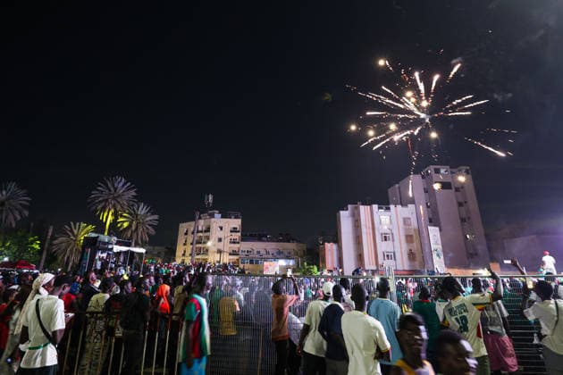 Senegal fans celebrate national team s World Cup victory in Dakar DAKAR, SENEGAL - JUNE 27: Senegalese fans celebrate their national team s 5-0 victory over Iraq in the FIFA World Cup at Place de la Nation in Dakar, Senegal, on June 27, 2026. Hundreds of supporters watch the match on giant screens set up in the square and cheer as Senegal scores each goal. Cem Ozdel Anadolu Dakar Senegal. Editorial use only. Please get in touch for any other usage.  Copyright: x2026xAnadoluxCemxOzdelx