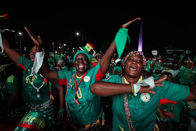 Senegal fans celebrate national team s World Cup victory in Dakar DAKAR, SENEGAL - JUNE 27: Senegalese fans celebrate their national team s 5-0 victory over Iraq in the FIFA World Cup at Place de la Nation in Dakar, Senegal, on June 27, 2026. Hundreds of supporters watch the match on giant screens set up in the square and cheer as Senegal scores each goal. Cem Ozdel Anadolu Dakar Senegal. Editorial use only. Please get in touch for any other usage.  Copyright: x2026xAnadoluxCemxOzdelx