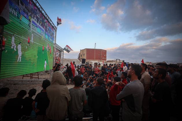 Palestinians watch the Iran-Egypt match on giant screens set up amid the rubble GAZA CITY, GAZA, PALESTINE - JUNE 27: Palestinians holding flags gather to watch the 2026 FIFA World Cup First Stage Group G match between Egypt and Iran on a giant screen set up among the rubble of destroyed buildings despite Israel s ongoing attacks in Gaza City, Gaza, Palestine, on June 27, 2026. Abdalhkem Abu Riash Anadolu Gaza City Gaza. Editorial use only. Please get in touch for any other usage.  Copyright: x2026xAnadoluxAbdalhkemxAbuxRiashx