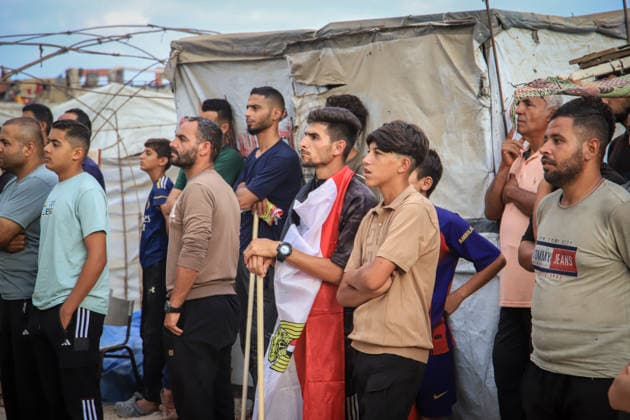 Palestinians watch the Iran-Egypt match on giant screens set up amid the rubble GAZA CITY, GAZA, PALESTINE - JUNE 27: Palestinians holding flags gather to watch the 2026 FIFA World Cup First Stage Group G match between Egypt and Iran on a giant screen set up among the rubble of destroyed buildings despite Israel s ongoing attacks in Gaza City, Gaza, Palestine, on June 27, 2026. Abdalhkem Abu Riash Anadolu Gaza City Gaza. Editorial use only. Please get in touch for any other usage.  Copyright: x2026xAnadoluxAbdalhkemxAbuxRiashx