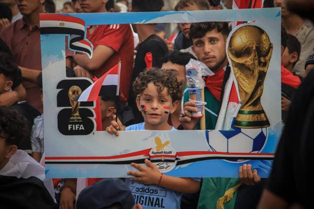 Palestinians watch the Iran-Egypt match on giant screens set up amid the rubble GAZA CITY, GAZA, PALESTINE - JUNE 27: Palestinians holding flags gather to watch the 2026 FIFA World Cup First Stage Group G match between Egypt and Iran on a giant screen set up among the rubble of destroyed buildings despite Israel s ongoing attacks in Gaza City, Gaza, Palestine, on June 27, 2026. Abdalhkem Abu Riash Anadolu Gaza City Gaza. Editorial use only. Please get in touch for any other usage.  Copyright: x2026xAnadoluxAbdalhkemxAbuxRiashx