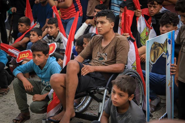 Palestinians watch the Iran-Egypt match on giant screens set up amid the rubble GAZA CITY, GAZA, PALESTINE - JUNE 27: Palestinians holding flags gather to watch the 2026 FIFA World Cup First Stage Group G match between Egypt and Iran on a giant screen set up among the rubble of destroyed buildings despite Israel s ongoing attacks in Gaza City, Gaza, Palestine, on June 27, 2026. Abdalhkem Abu Riash Anadolu Gaza City Gaza. Editorial use only. Please get in touch for any other usage.  Copyright: x2026xAnadoluxAbdalhkemxAbuxRiashx