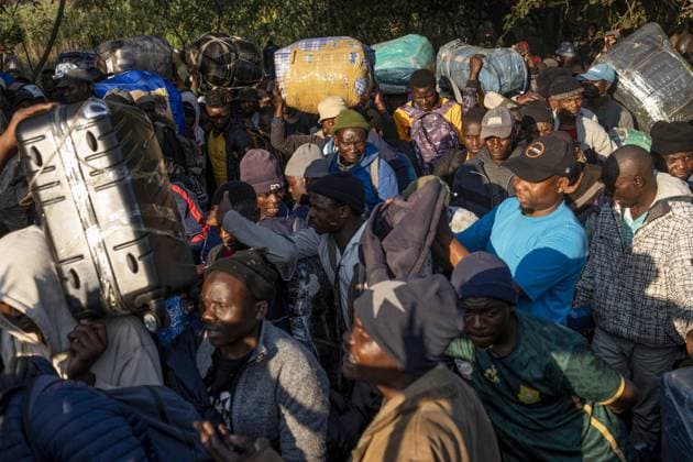 Undocumented Malawian migrants are being evacuated from South Africa KWAZULU-NATAL, SOUTH AFRICA - JUNE 26: Men carry their loads as thousands of Malawian migrants were put on buses to return to their home country following a rise in xenophobic attacks and anti-immigrant protests in the city of Pietermaritzburg in KwaZulu-Natal province, South Africa, on June 26, 2026. Ihsaan Haffejee Anadolu KwaZulu-Natal South Africa. Editorial use only. Please get in touch for any other usage.  Copyright: x2026xAnadoluxIhsaanxHaffejeex