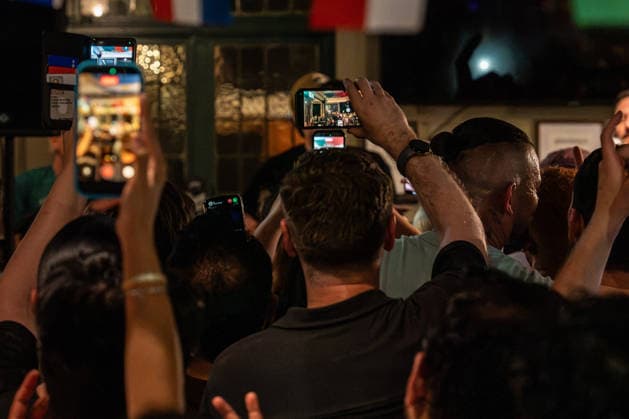 June 26, 2026, London, United Kingdom: View from a back of a packed out pub of crowds holding phones in the air to capture Danny O Donoghue performance with his band The Script. Irish band The Script fronted by Danny O Donoghue played a durpeise pop up gig in a pub The Dog formally known as The Dog and Truck in Whitechapel London after playing London Stadium supporting Take That on their tour. London United Kingdom - ZUMAs197 20260626_aaa_s197_235 Copyright: xBonniexBritainx
