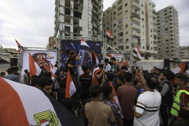 RECORD DATE NOT STATED Palestinians watch the Iran-Egypt match on giant screens set up amid the rubble Palestinians holding flags gather to watch the 2026 FIFA World Cup First Stage Group G match between Egypt and Iran on a giant screen set up among the rubble of destroyed buildings despite Israel s ongoing attacks in Gaza City. Credit: Hashem Zimmo TheNews2(Foto: Hashem Zimmo Thenews2 imago images) Palestinians watch the Iran-Egypt match on giant screens set up amid the rubble  Copyright: xHashemxZimmox