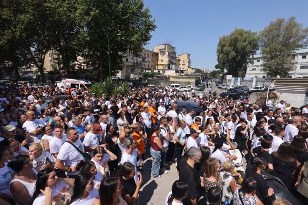 IPA86125444 - Naples: The funeral of Lorenzo Spasiano, the 19-year-old worker killed in Miano by a gunshot to the chest. A huge crowd gathered outside the church to say a final goodbye to Lorenzo  Copyright: xx xx 86125444