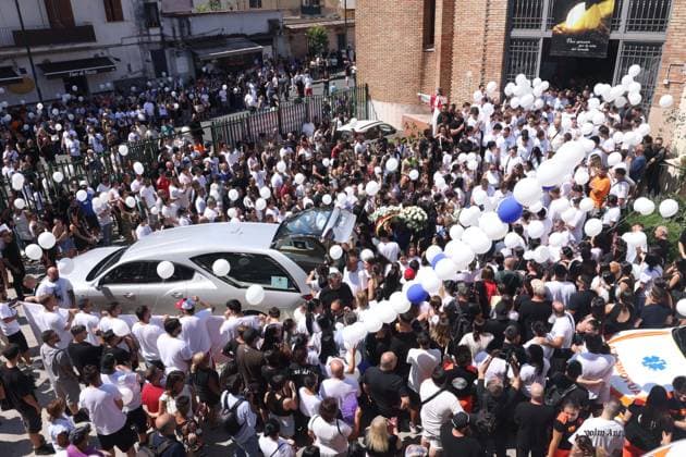 IPA86125501 - Naples: The funeral of Lorenzo Spasiano, the 19-year-old worker killed in Miano by a gunshot to the chest. A huge crowd gathered outside the church to say a final goodbye to Lorenzo  Copyright: xx xx 86125501