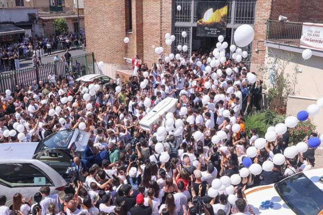 IPA86125531 - Naples: The funeral of Lorenzo Spasiano, the 19-year-old worker killed in Miano by a gunshot to the chest. A huge crowd gathered outside the church to say a final goodbye to Lorenzo  Copyright: xx xx 86125531