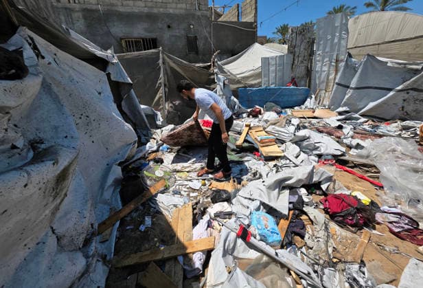 Displaced Palestinians inspect damaged tents after strike in al-Mawasi Displaced Palestinians inspect damage to their tents after an Israeli strike targeted a tent in the al-Mawasi area of Khan Younis, southern Gaza Strip, on June 27, 2026. The strike killed a young man and a child, wounded others, and caused extensive damage to displaced families tents and belongings. Photo by Tariq Mohammad APA Images Khan Yunis Gaza Strip Palestinian Territory 270626_Khan_Yunis_TM_02(1) Copyright: xapaimagesxTariqxMohammad xapaimagesx