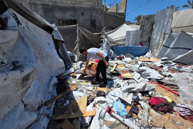 Displaced Palestinians inspect damaged tents after strike in al-Mawasi Displaced Palestinians inspect damage to their tents after an Israeli strike targeted a tent in the al-Mawasi area of Khan Younis, southern Gaza Strip, on June 27, 2026. The strike killed a young man and a child, wounded others, and caused extensive damage to displaced families tents and belongings. Photo by Tariq Mohammad APA Images Khan Yunis Gaza Strip Palestinian Territory 270626_Khan_Yunis_TM_02(26) Copyright: xapaimagesxTariqxMohammad xapaimagesx