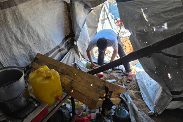 Displaced Palestinians inspect damaged tents after strike in al-Mawasi Displaced Palestinians inspect damage to their tents after an Israeli strike targeted a tent in the al-Mawasi area of Khan Younis, southern Gaza Strip, on June 27, 2026. The strike killed a young man and a child, wounded others, and caused extensive damage to displaced families tents and belongings. Photo by Tariq Mohammad APA Images Khan Yunis Gaza Strip Palestinian Territory 270626_Khan_Yunis_TM_02(4) Copyright: xapaimagesxTariqxMohammad xapaimagesx
