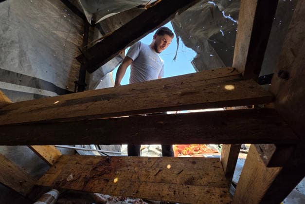 Displaced Palestinians inspect damaged tents after strike in al-Mawasi Displaced Palestinians inspect damage to their tents after an Israeli strike targeted a tent in the al-Mawasi area of Khan Younis, southern Gaza Strip, on June 27, 2026. The strike killed a young man and a child, wounded others, and caused extensive damage to displaced families tents and belongings. Photo by Tariq Mohammad APA Images Khan Yunis Gaza Strip Palestinian Territory 270626_Khan_Yunis_TM_02(7) Copyright: xapaimagesxTariqxMohammad xapaimagesx
