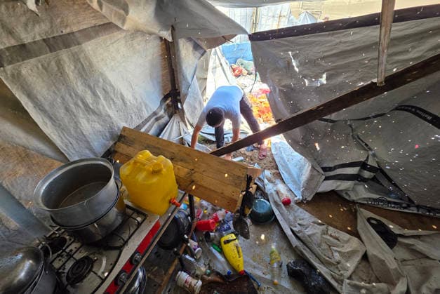 Displaced Palestinians inspect damaged tents after strike in al-Mawasi Displaced Palestinians inspect damage to their tents after an Israeli strike targeted a tent in the al-Mawasi area of Khan Younis, southern Gaza Strip, on June 27, 2026. The strike killed a young man and a child, wounded others, and caused extensive damage to displaced families tents and belongings. Photo by Tariq Mohammad APA Images Khan Yunis Gaza Strip Palestinian Territory 270626_Khan_Yunis_TM_02(5) Copyright: xapaimagesxTariqxMohammad xapaimagesx