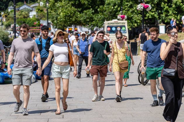June 27, 2026, London, UK: London, UK. Walkers enjoy the sunshine on a busy Richmond Riverside south west London today as weather forecasters announce the end of the June record braking heatwave. The Met Office have issued another extreme heat weather warning for London and the South East today as temperatures are set to hit to over 31c. However, cooler weather is forecast tomorrow. London UK  - ZUMAl94_ 20260627_zaf_l94_016 Copyright: xAlexxLentatix