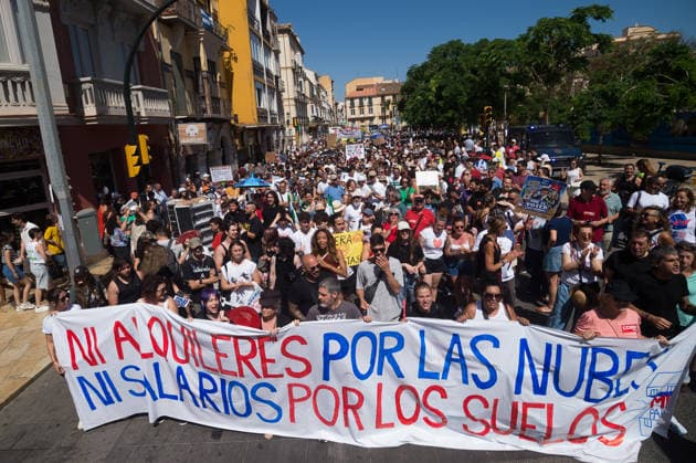 June 27, 2026, Malaga, Spain: Protesters march on the streets holding a banner as they take part in a demonstration in favor of decent housing. Social organisations and community groups belonging to the Malaga para Vivir platform have denounced the growing difficulty of accessing decent housing due to rising rates and the increasing cost of living in the city. As a result, they are calling for a general strike over the housing crisis. Malaga Spain - ZUMAs197 20260627_aaa_s197_006 Copyright: xJesusxMeridax
