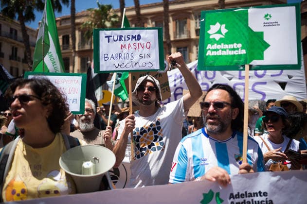 June 27, 2026, Malaga, Spain: Protesters seen holding placards as they take part in a demonstration in favor of decent housing. Social organisations and community groups belonging to the Malaga para Vivir platform have denounced the growing difficulty of accessing decent housing due to rising rates and the increasing cost of living in the city. As a result, they are calling for a general strike over the housing crisis. Malaga Spain - ZUMAs197 20260627_aaa_s197_018 Copyright: xJesusxMeridax