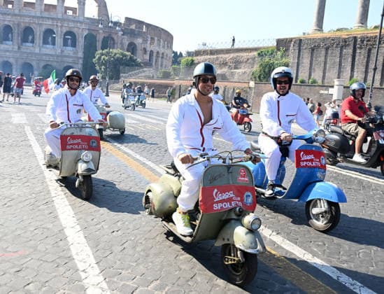 (260627) -- ROME, June 27, 2026 -- Vespa enthusiasts parade around the Colosseum during a celebration marking the 80th anniversary of the iconic Italian brand of scooters, in Rome, Italy, on June 27, 2026. (Photo by Xinhua) ITALY-ROME-VESPA SCOOTER-PARADE AlbertoxLingria 