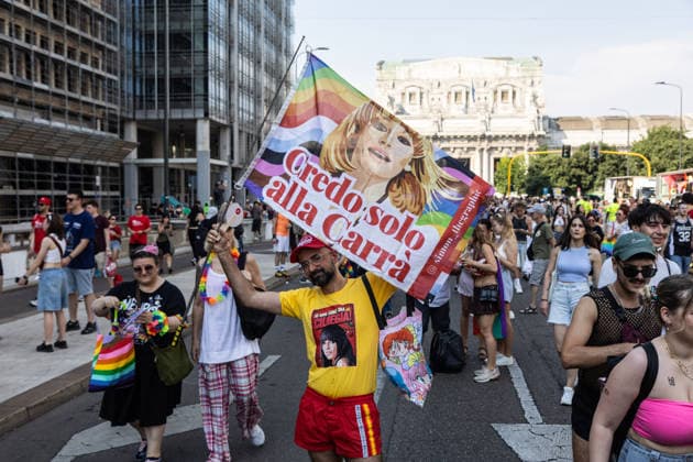 IPA86131331 - Milan, Central Station, Via Vittor Pisani, June 27, 2026, Milan Pride flag sign reading I only believe in CarrÃ  Copyright: xFrancescoxEnriquezx xFrancescoxEnriquezx 86131331