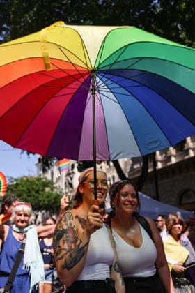June 27, 2026, Budapest, Hungary, European Union: Two women under a rainbow umbrella smile at the camera during Budapest Pride, the first Pride march held since HungaryÃ¢â‚¬â ¢s April 2026 parliamentary election. The annual event brought together LGBTQ+ people, allies and supporters calling for equality, visibility and acceptance. Budapest European Union  - ZUMAo116 20260627_znp_o116_060 Copyright: xBiancaxOterox