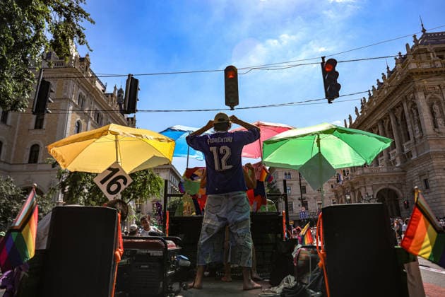 June 27, 2026, Budapest, Hungary, European Union: A man stands with arms up during a DJ set on a parade float at a stop light on Andrassy ut and in front of the Opera House adorned with different colored umbrellas during Budapest Pride, the first Pride march held since HungaryÃ¢â‚¬â ¢s April 2026 parliamentary election. The annual event brought together LGBTQ+ people, allies and supporters calling for equality, visibility and acceptance. Budapest European Union  - ZUMAo116 20260627_znp_o116_067 Copyright: xBiancaxOterox
