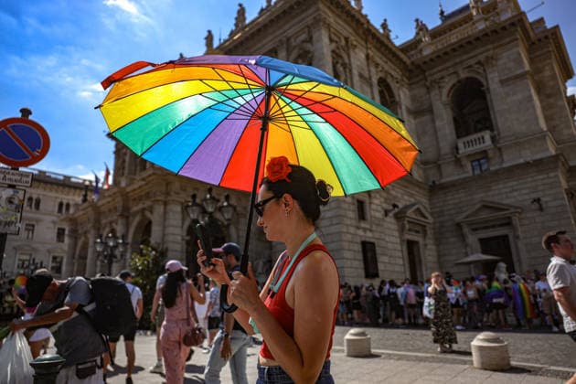June 27, 2026, Budapest, Hungary, European Union: A woman with a rainbow umbrella and a flower in her hair in front of the Opera House during Budapest Pride, the first Pride march held since HungaryÃ¢â‚¬â ¢s April 2026 parliamentary election. The annual event brought together LGBTQ+ people, allies and supporters calling for equality, visibility and acceptance. Budapest European Union  - ZUMAo116 20260627_znp_o116_068 Copyright: xBiancaxOterox