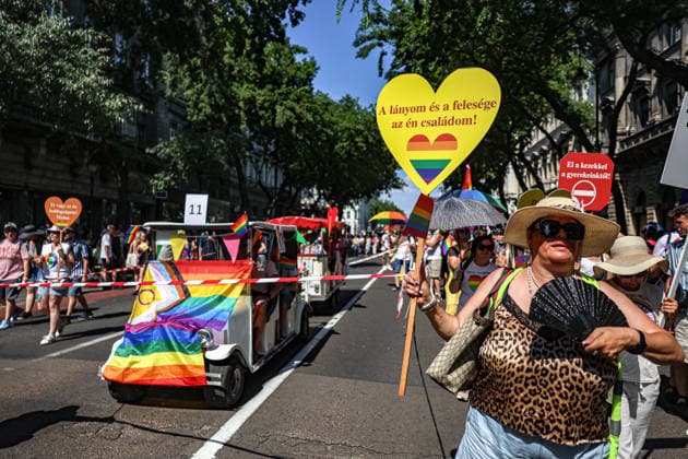 June 27, 2026, Budapest, Hungary, European Union: A woman holds a heart shaped sign that says, My Daughter and My Wife Are My Family in Hungarian, and a small parade float with the pride flag in background, during Budapest Pride, the first Pride march held since HungaryÃ¢â‚¬â ¢s April 2026 parliamentary election. The annual event brought together LGBTQ+ people, allies and supporters calling for equality, visibility and acceptance. Budapest European Union  - ZUMAo116 20260627_znp_o116_071 Copyright: xBiancaxOterox