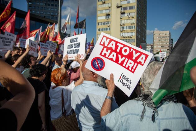June 27, 2026, Istanbul, Istanbul, Turkey: Activists from the No to NATO! Coordination staged a protest in front of Trump Towers in Istanbul, Turkey, carrying a banner reading Imperialist war organization NATO and Trump, you are not welcome! The demonstration opposed the upcoming NATO Summit scheduled to take place in Ankara on July 7Ã¢â‚¬8. Istanbul Turkey - ZUMAt171 20260627_zip_t171_023 Copyright: xAbdullahxTepelix