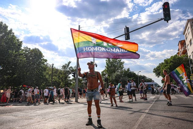 June 27, 2026, Budapest, Hungary, European Union: A man waves a pride flag that says Homokomando, meaning Gay Commando, during Budapest Pride, the first Pride march held since HungaryÃ¢â‚¬â ¢s April 2026 parliamentary election. The annual event brought together LGBTQ+ people, allies and supporters calling for equality, visibility and acceptance. Budapest European Union  - ZUMAo116 20260627_znp_o116_089 Copyright: xBiancaxOterox